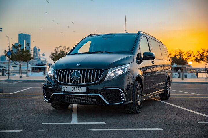 Experience luxurious comfort as you glide through Dubai in the Falcon Edition van perfect for discovering the city's stunning sights with your group in style and privacy.